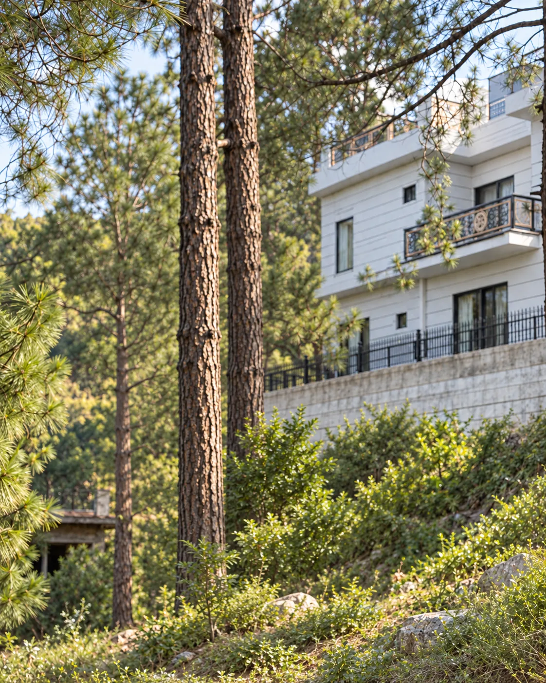 A residence beside a stone retaining wall